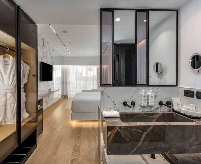 Ethereal White Resort Heraklion Deluxe Suite washbasins and wardrobe