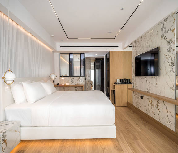 Ethereal White Resort Heraklion Deluxe Suite room, double bed and amenities