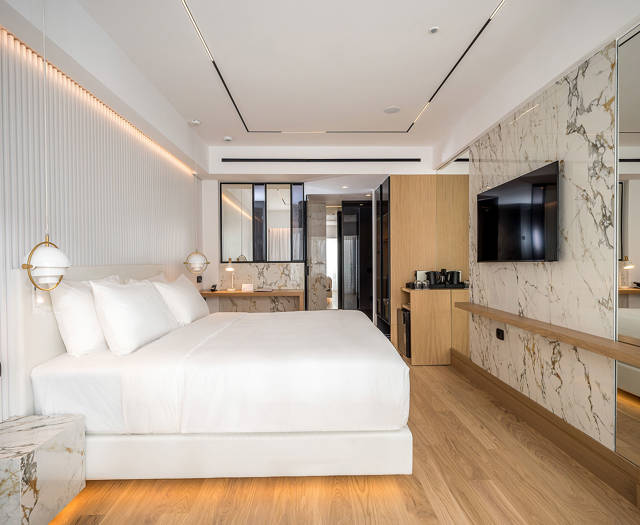 Ethereal White Resort Heraklion Deluxe Suite room, double bed and amenities