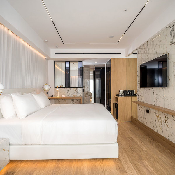 Ethereal White Resort Heraklion Deluxe Suite room, double bed and amenities