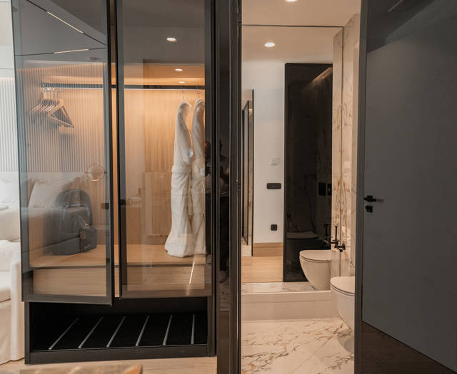 Ethereal White Resort Heraklion Deluxe Suite wardrobe and bathroom entrance