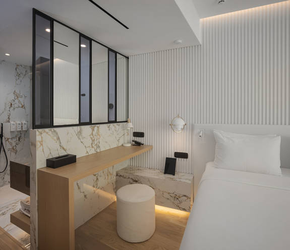 Ethereal White Resort Heraklion Junior Suite room amenities and double bed