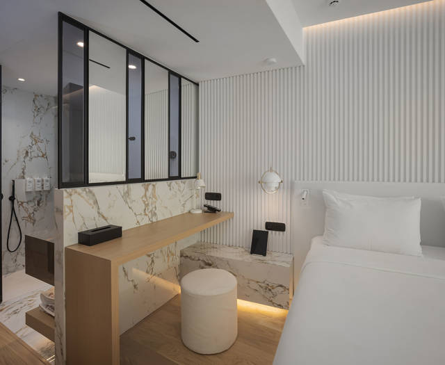Ethereal White Resort Heraklion Junior Suite room amenities and double bed