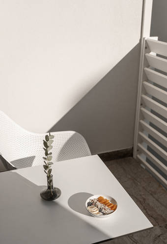 Ethereal White Resort Heraklion Deluxe Suite decorated balcony table and chair