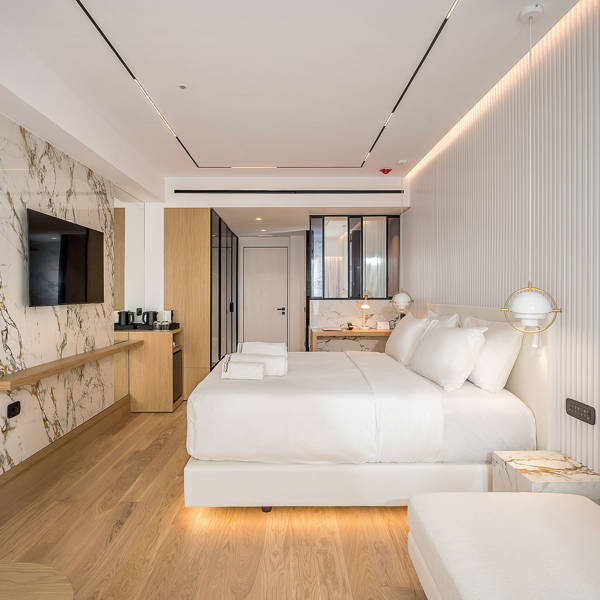 Ethereal White Resort Heraklion Deluxe Suite room, double bed and amenities