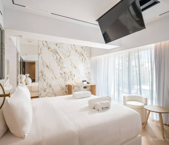 Ethereal White Resort Heraklion Luxury Suite double bed and room amenities