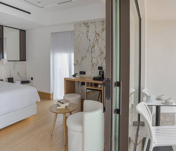 Ethereal White Resort Heraklion Luxury Suite bedroom and balcony view