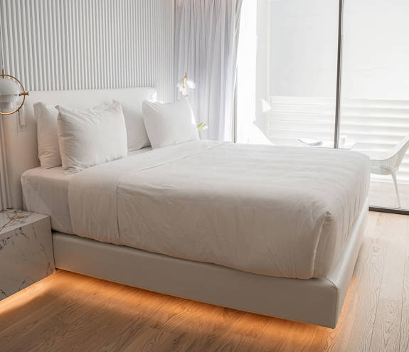 Ethereal White Resort Heraklion Deluxe Suite double bed and balcony view