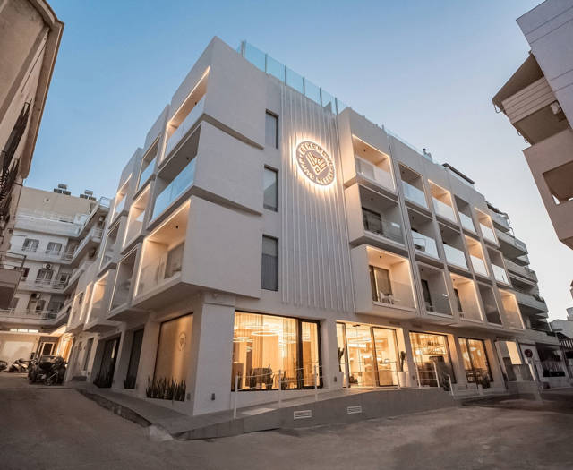Ethereal White Resort Heraklion hotel exterior lit up at dusk