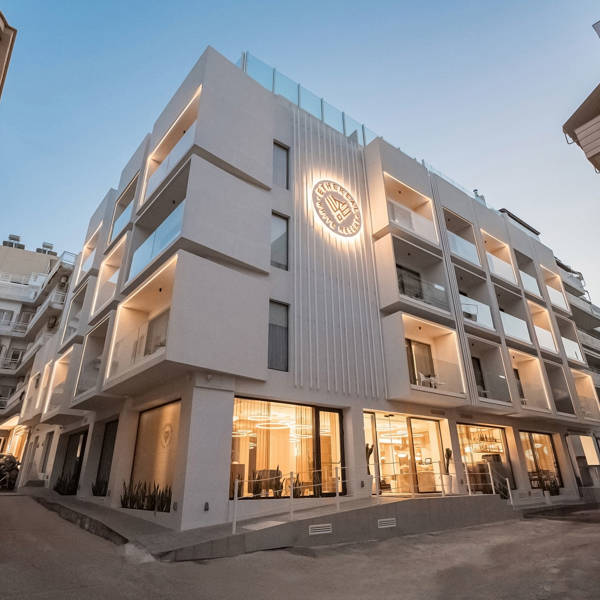 Ethereal White Resort Heraklion hotel exterior lit up at dusk