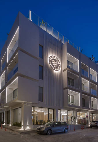Ethereal White Resort Heraklion hotel exterior lit up at night