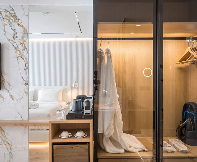 Ethereal White Resort Heraklion Deluxe Suite room amenities and wardrobe