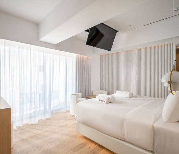 Ethereal White Resort Heraklion Luxury Suite double bed and amenities
