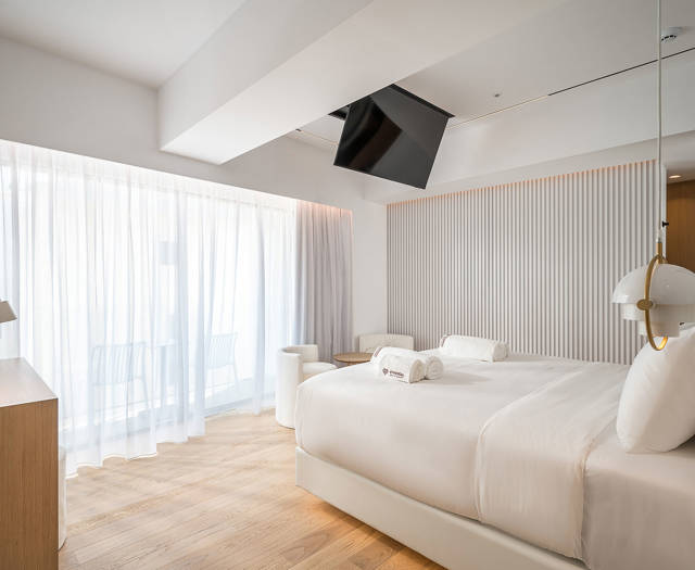 Ethereal White Resort Heraklion Luxury Suite double bed and amenities
