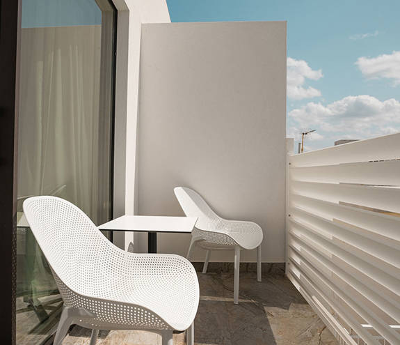 Ethereal White Resort Heraklion Deluxe Suite Swim Up balcony chairs and table