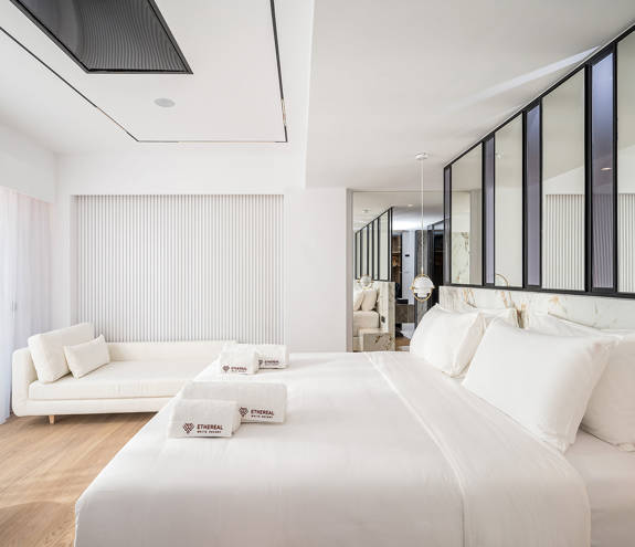 Ethereal White Resort Heraklion Luxury Suite double bed and couch